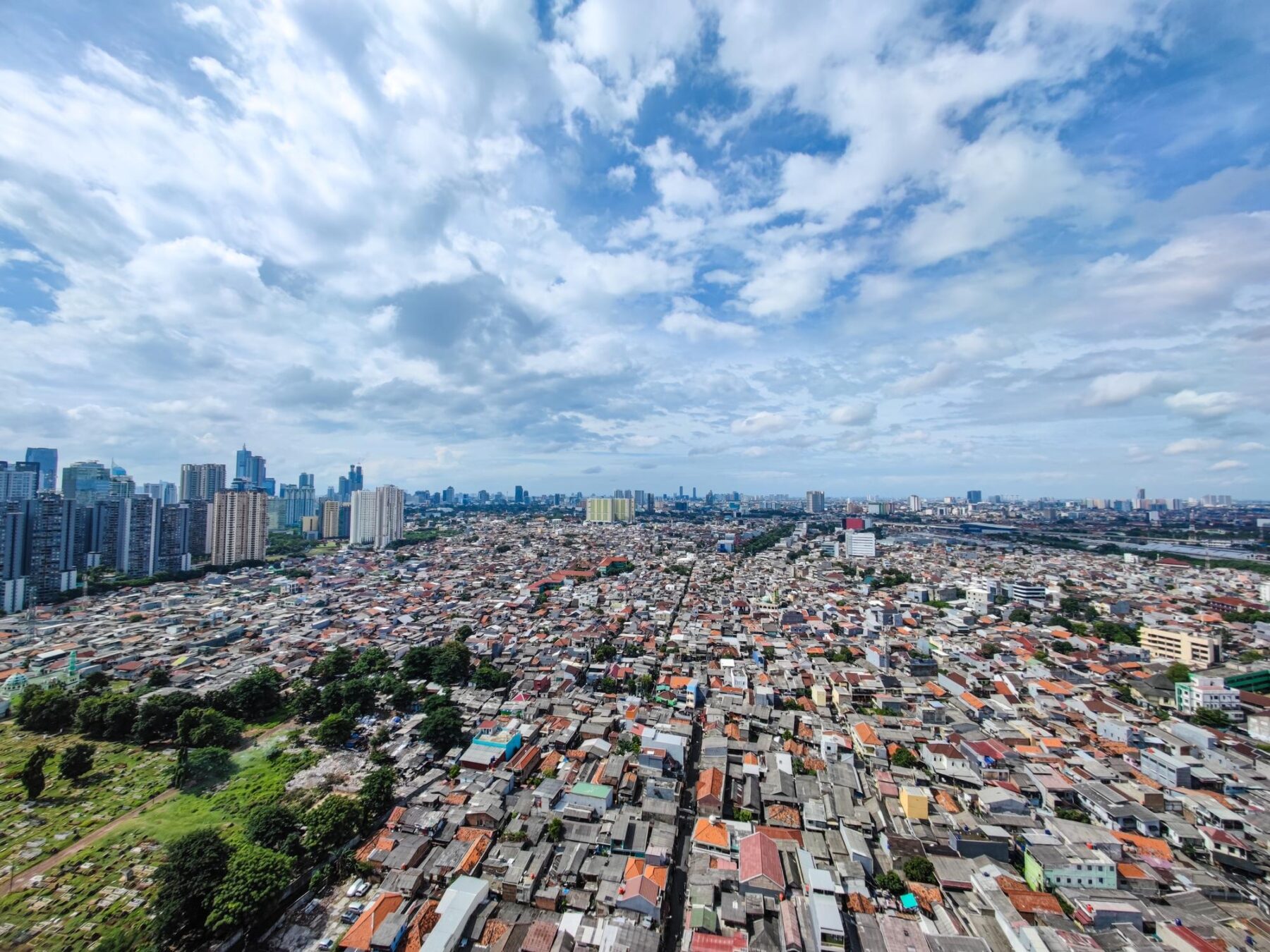 Aerial view of Jakarta's high-rise skyline and dense neighbourhoods