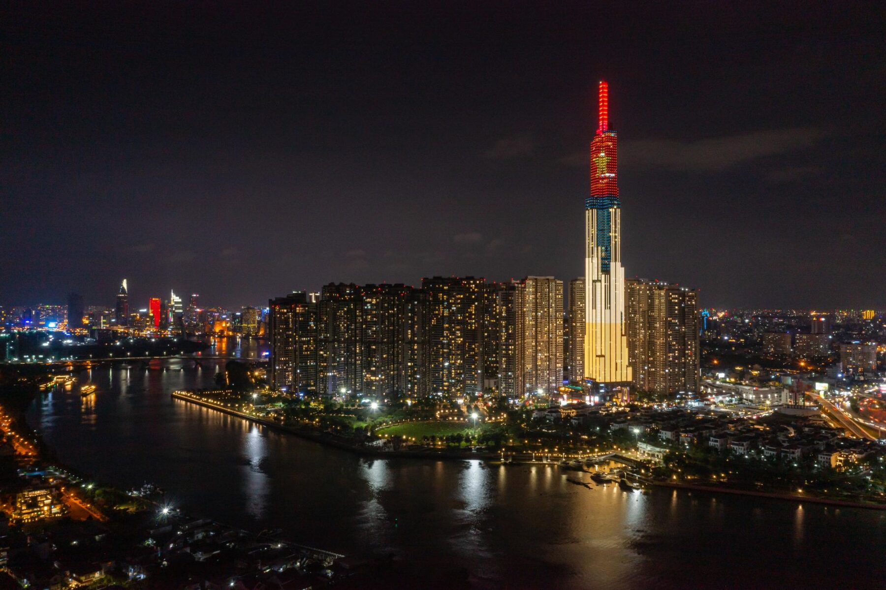 Ho Chi Minh City skyline at night beside the Saigon River