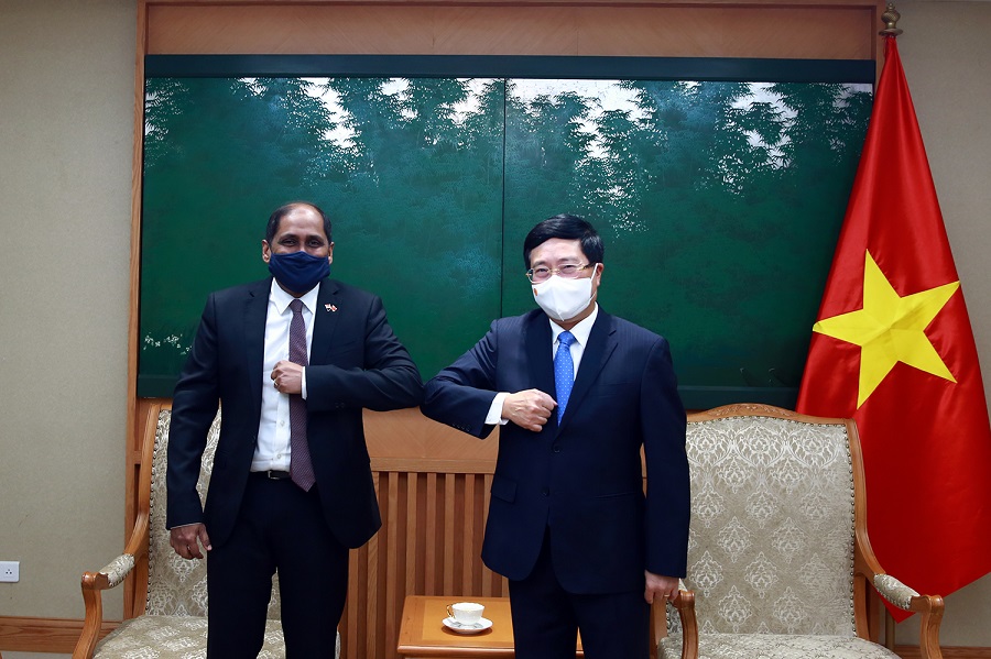 Vietnamese Deputy Prime Minister Pham Binh Minh right and Singaporean Ambassador to Vietnam Jaya Ratnam in Hanoi on May