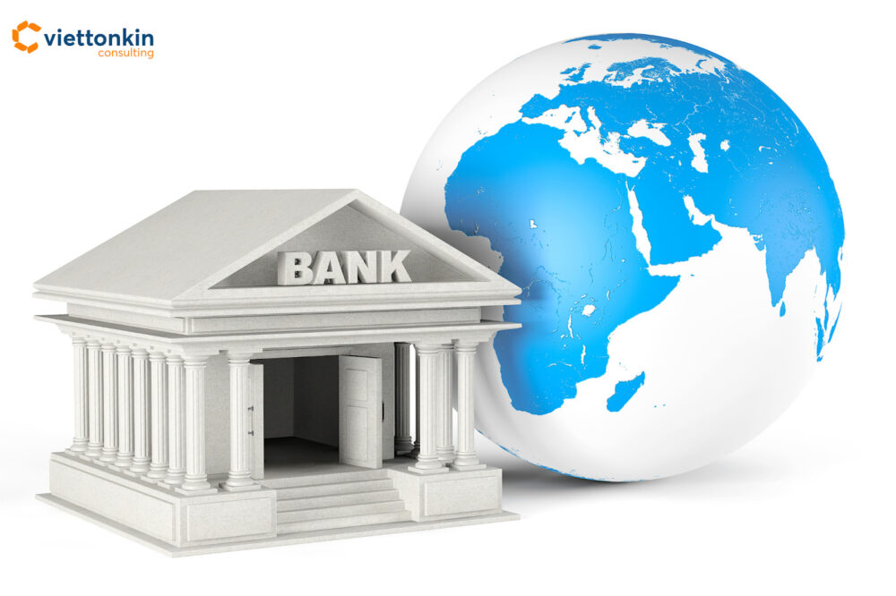 A classical bank building in front of a globe, symbolizing the entry and establishment of foreign banks in Vietnam’s financial market.