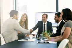 Business handshake acquisition meeting in Vietnamese manufacturing